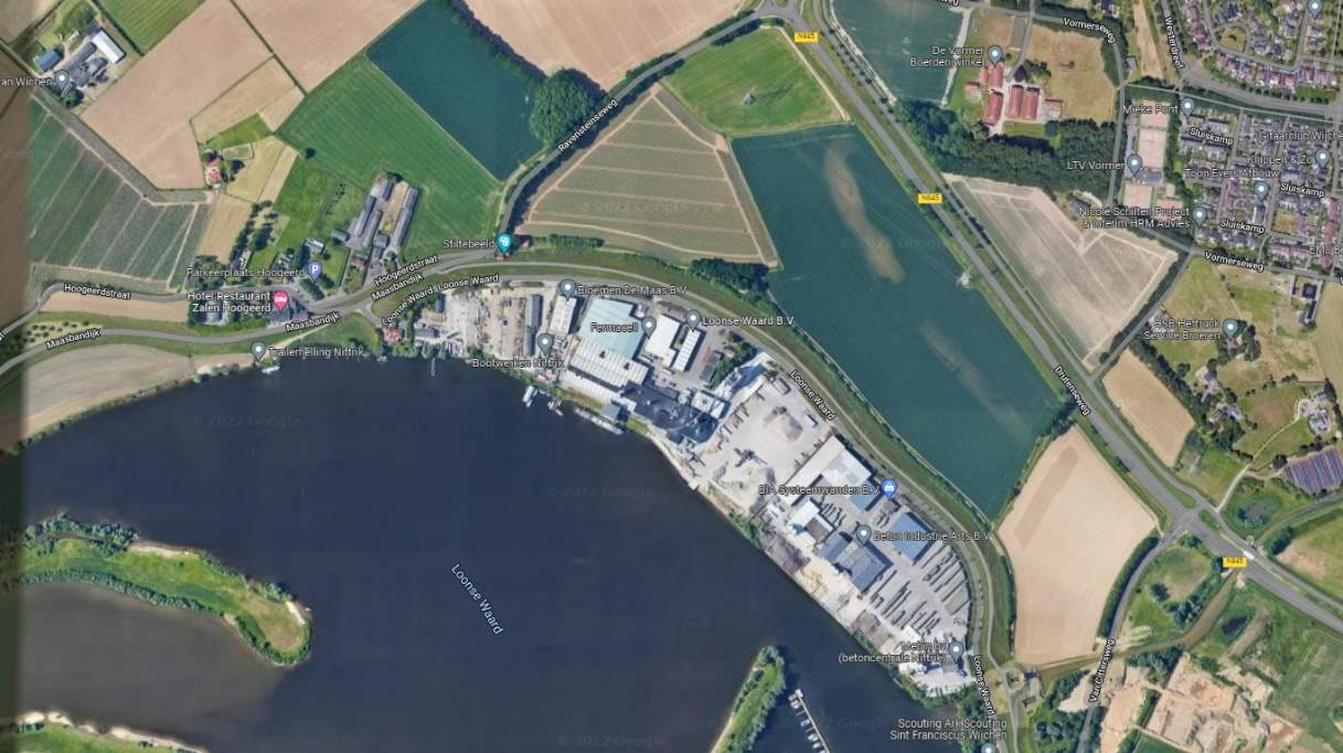 Deze afbeelding geeft een voorbeeld van buitendijkse bedrijvigheid in Wijchen. Het gaat om een leverancier van bouwmaterialen langs de Loonse Waard.